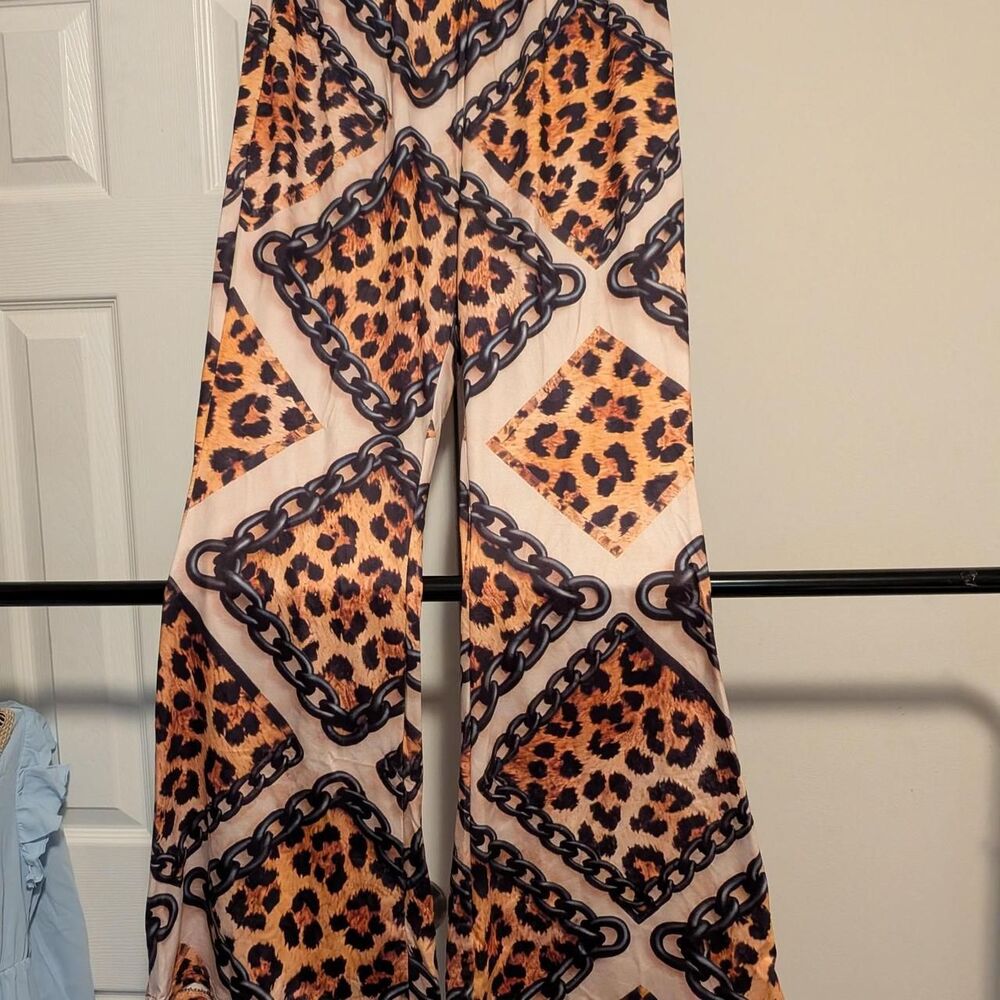 Leopard print pants with black chain-link design